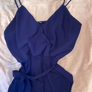 Navy blue jumpsuit with scrunched ankles and waist tie